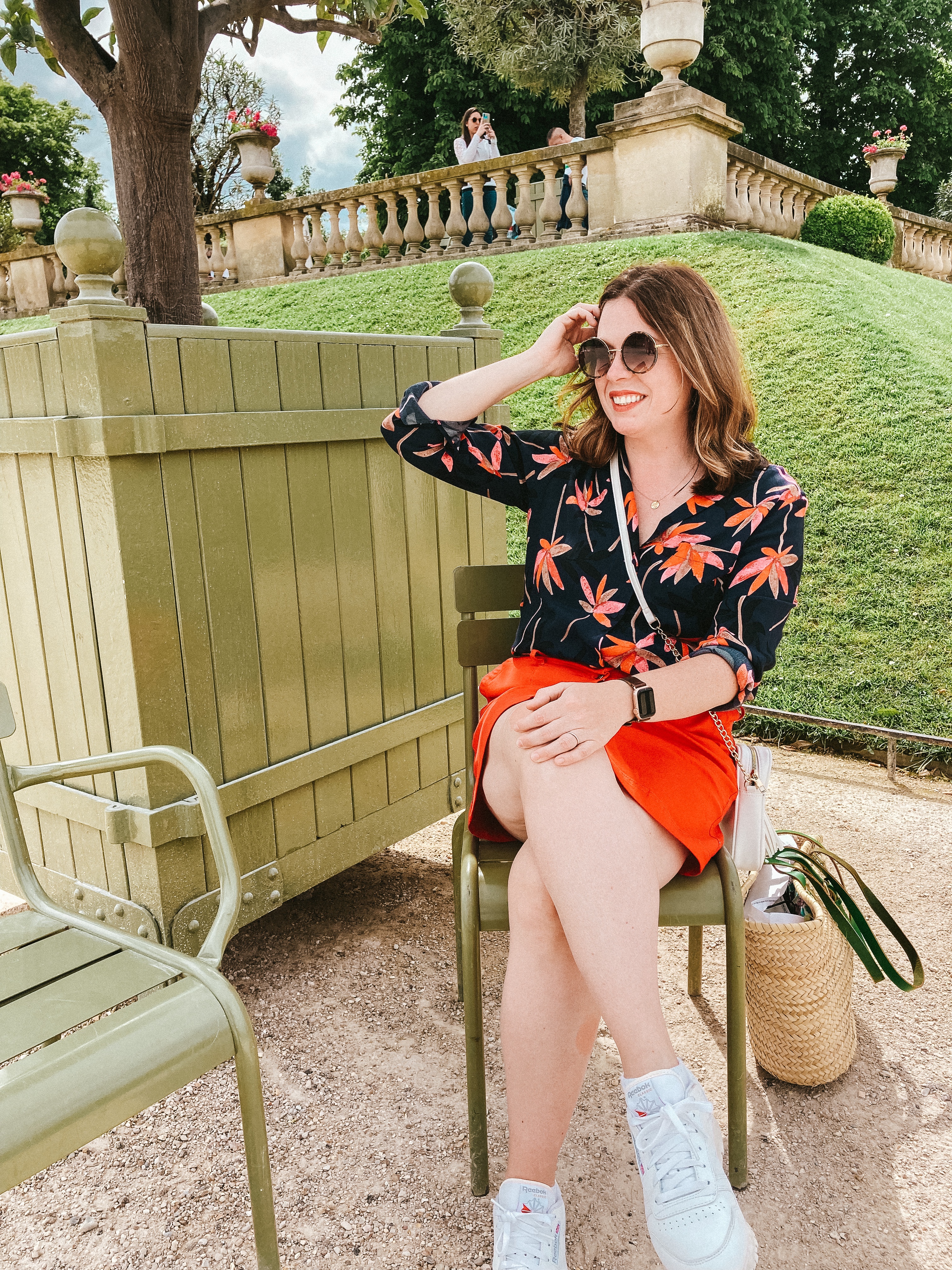 Green metal chairs and landscaping in the Jardin du Luxembourg, Paris.