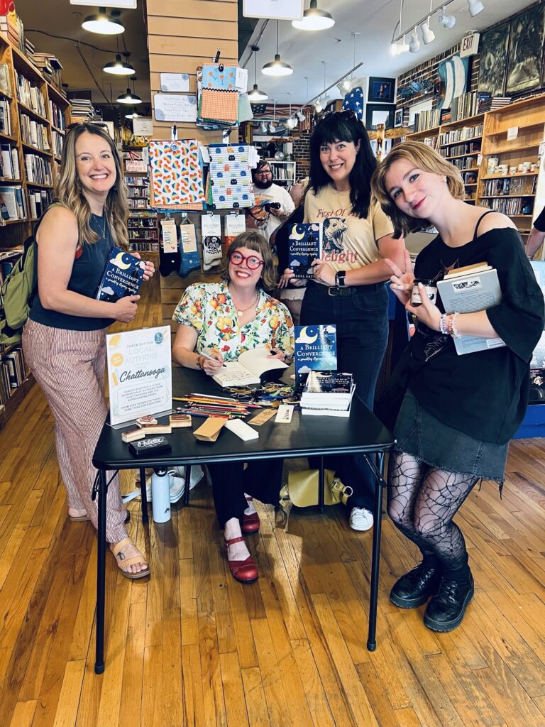 author signs books at a local bookstore